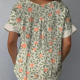 Aida - Camisa casual para mulher em algodão e linho com um bonito design floral e estampado artístico